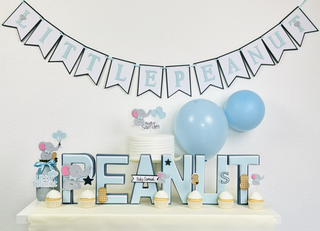 Soft blue elephant baby shower ideas featuring a Little Peanut theme and coordinated dessert table decor