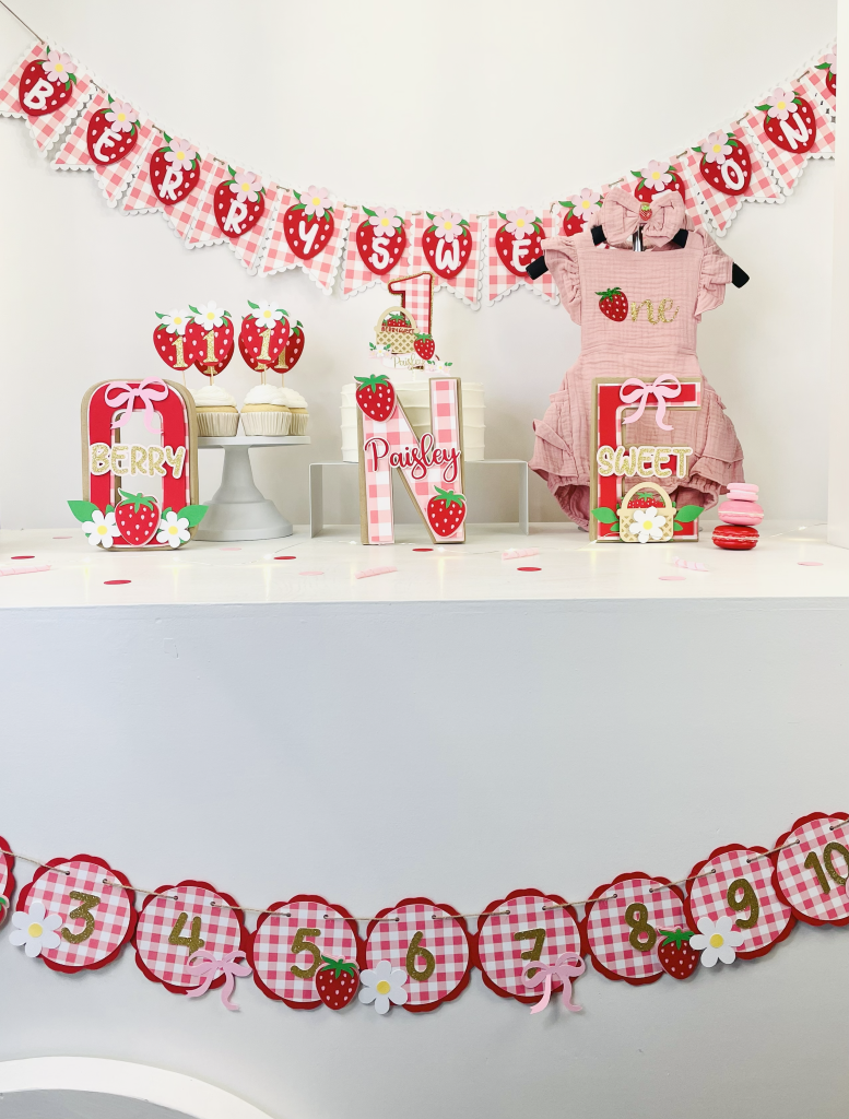 Berry First Birthday Party Ideas with matching decorations bundle including cake topper, banner, and centerpiece