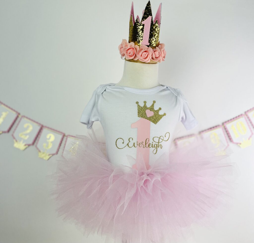 First birthday personalized princess pink tutu with white shirt, pink one, and first name and gold crown